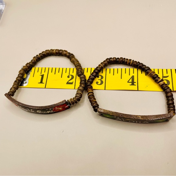 Two Hawaiian coconut shell bracelets. One saying Aloha and one North Shore. - Picture 6 of 6